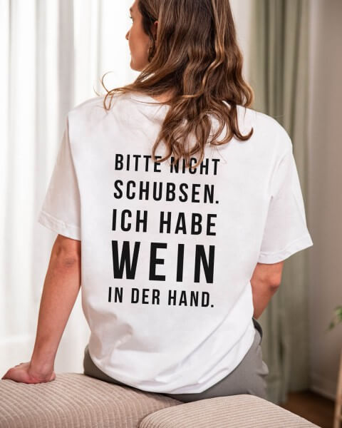 Bitte nicht schubsen. Ich habe Wein in der Hand. 